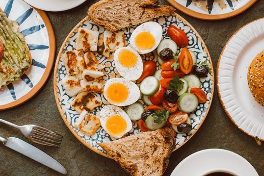 A colorful meal with eggs, vegetables and toast