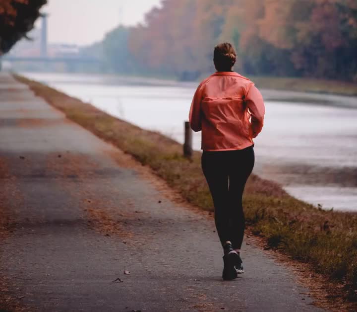 A runner beside a quiet river